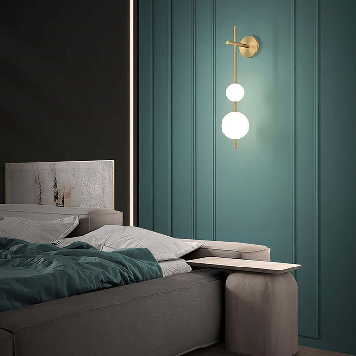 Applique murale boule verticale aspect doré