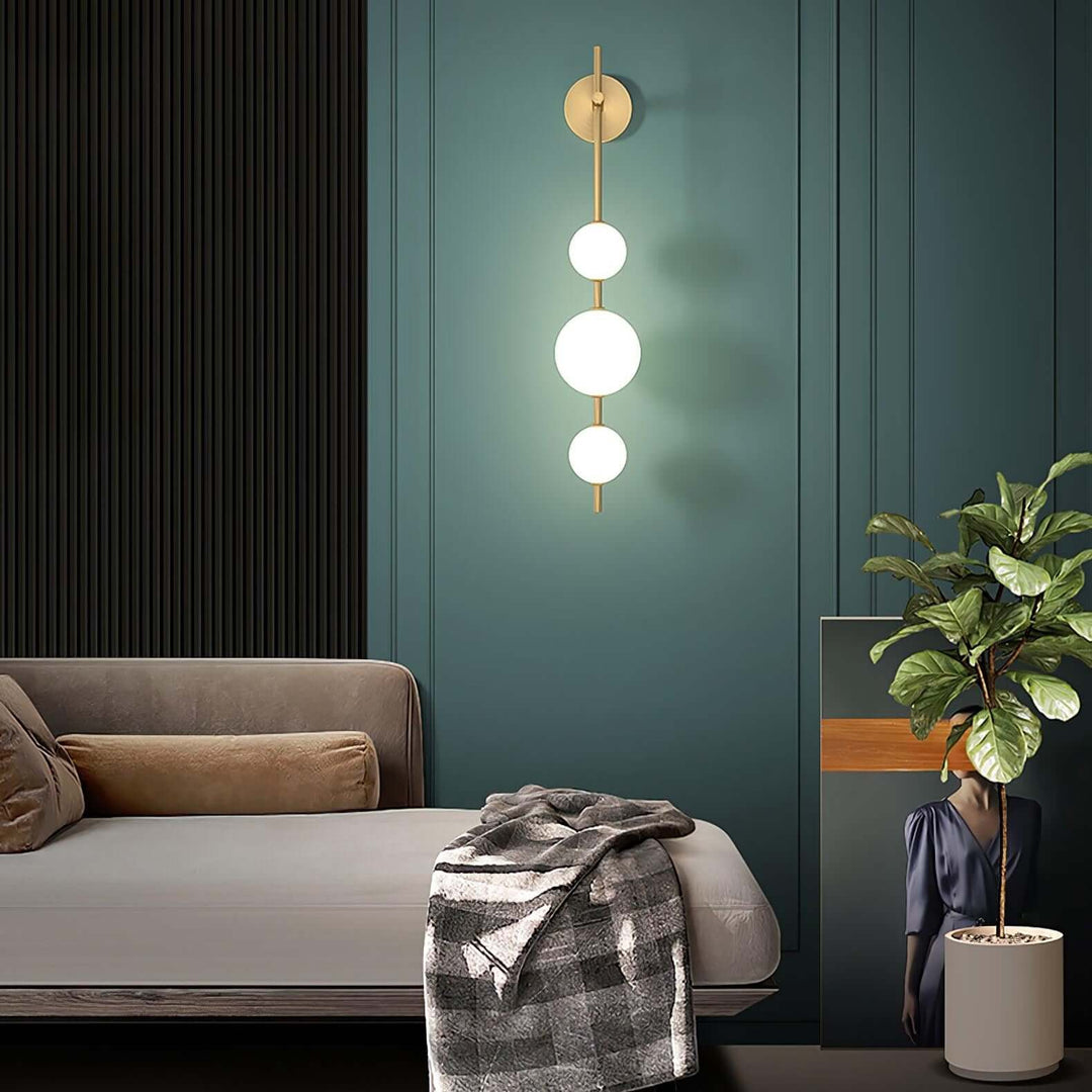 Applique murale boule verticale aspect doré