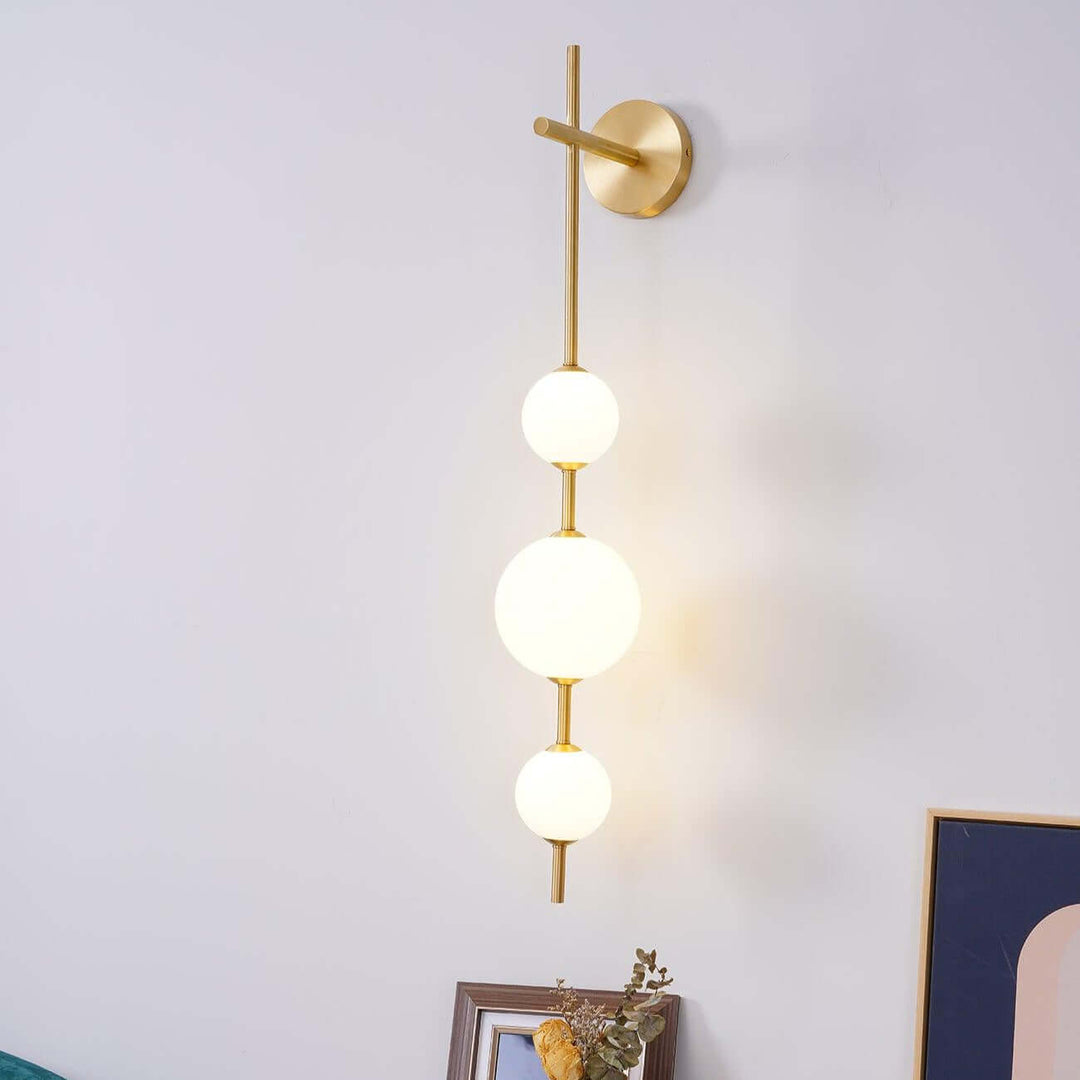 Applique murale boule verticale aspect doré