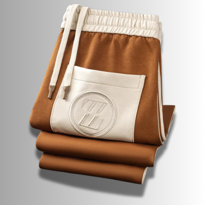 "Atmungsaktiver Herren Jogginganzug, modern geschnitten, grau, mit Kapuze und elastischem Bund für optimalen Tragekomfort."