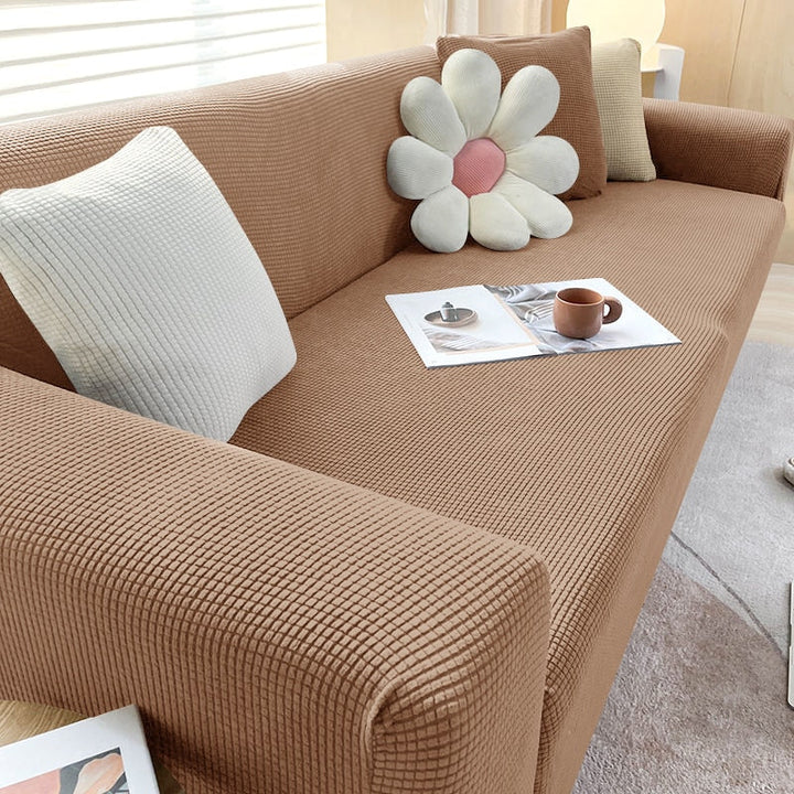 Beige Sofahusse aus elastischem Stretchmaterial, perfekter Sitz, Schutz vor Flecken, Schmutz und Tierhaaren.