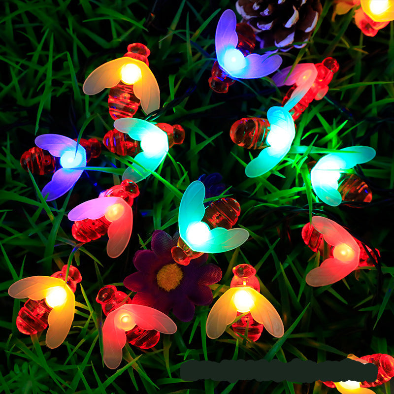 "Bunte Solar Blumenlichterkette im Garten bei Nacht, wetterfest, umweltfreundlich, Blumenform, stimmungsvolle Beleuchtung"