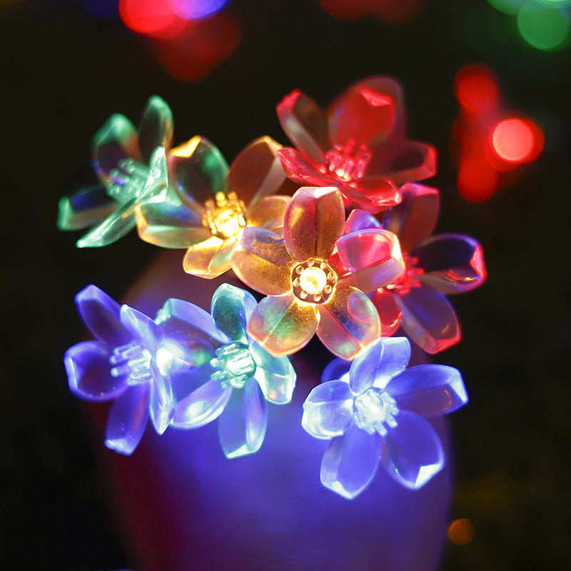 "Bunte Solar Blumenlichterkette im Garten bei Nacht, wetterfest, umweltfreundlich, Blumenform, stimmungsvolle Beleuchtung"