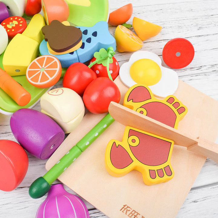 "Buntes Montessori Schneide Spielset aus Holz, featuring buntes Obst und Gemüse, ideal zum Fördern der Feinmotorik."