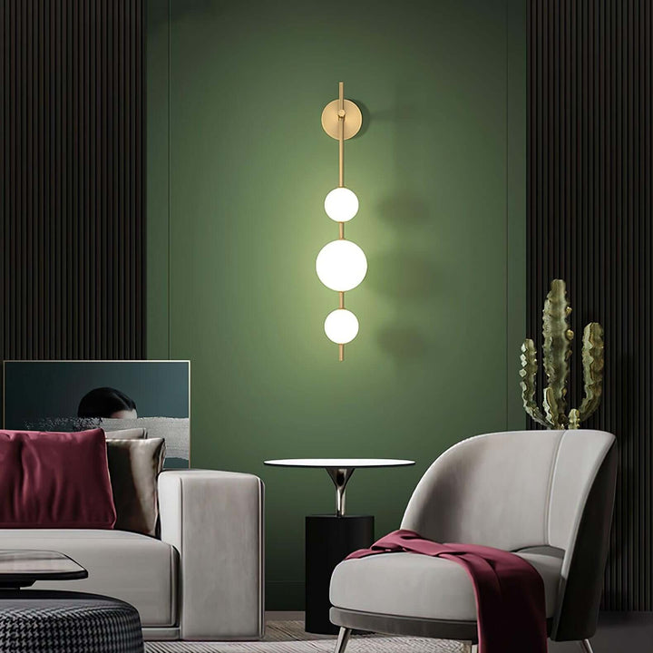 Applique murale boule verticale aspect doré