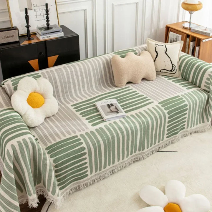 "Elegant skandinavischer Sofabezug mit Quasten, schützend und anpassbar, in verschiedenen Größen und Farben erhältlich."