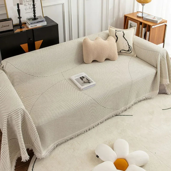 "Elegant skandinavischer Sofabezug mit Quasten, schützend und anpassbar, in verschiedenen Größen und Farben erhältlich."