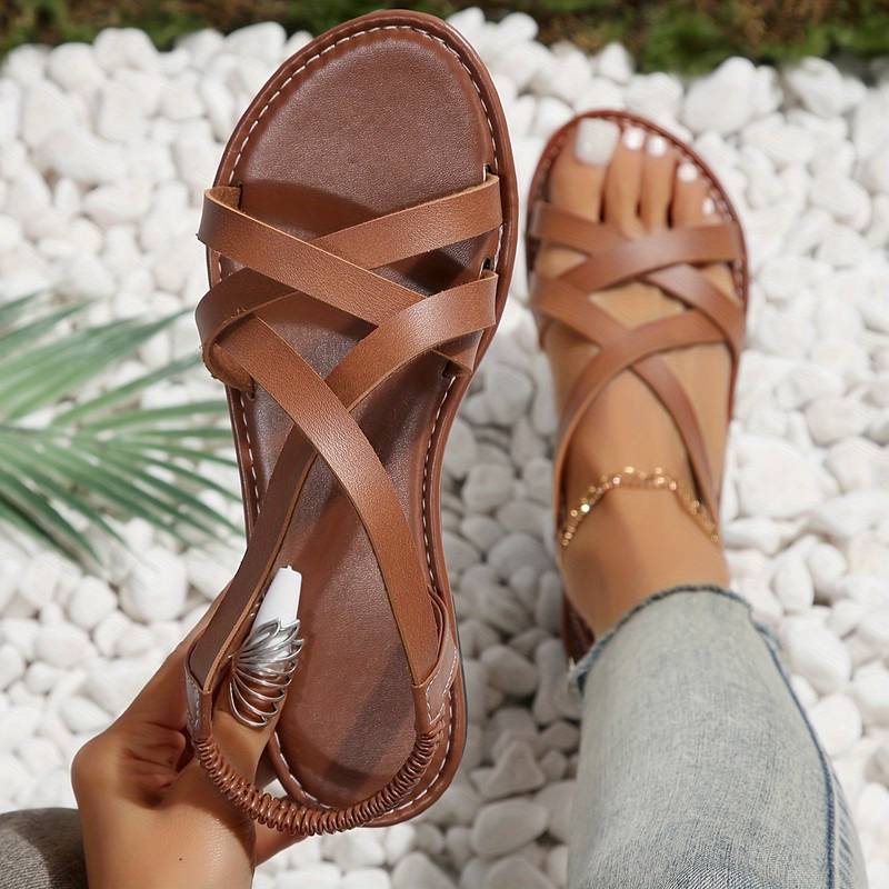 Elegante Crisscross Sandalen mit rutschfesten Riemen, flach, vielseitig kombinierbar, ideal für Sommer und Stadt.