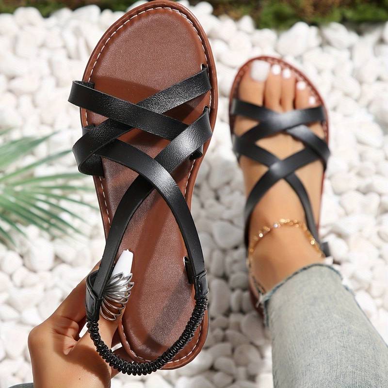 Elegante Crisscross Sandalen mit rutschfesten Riemen, flach, vielseitig kombinierbar, ideal für Sommer und Stadt.