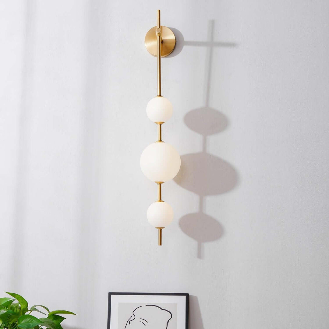 Applique murale boule verticale aspect doré