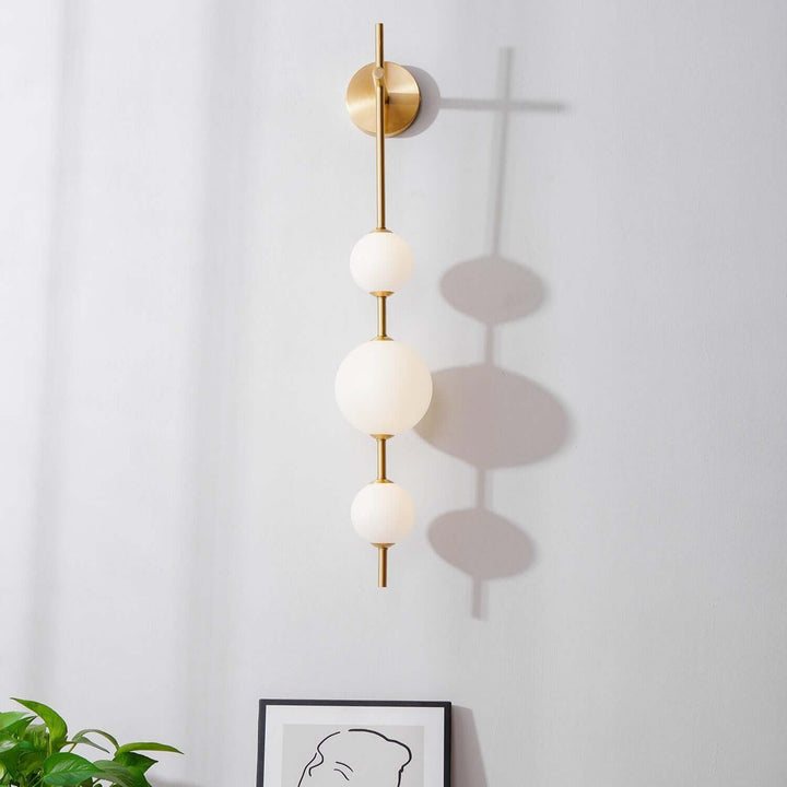 Applique murale boule verticale aspect doré