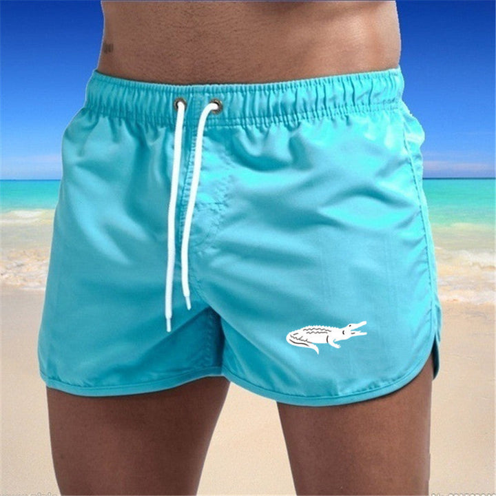 "Mehrfarbige, leichte Strand-Shorts mit elastischem Bund und modernem Druck, perfekt für Sommer und Sport."