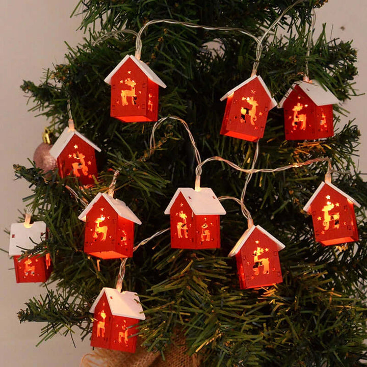 Hängende Holz-Weihnachtshäuser mit LED