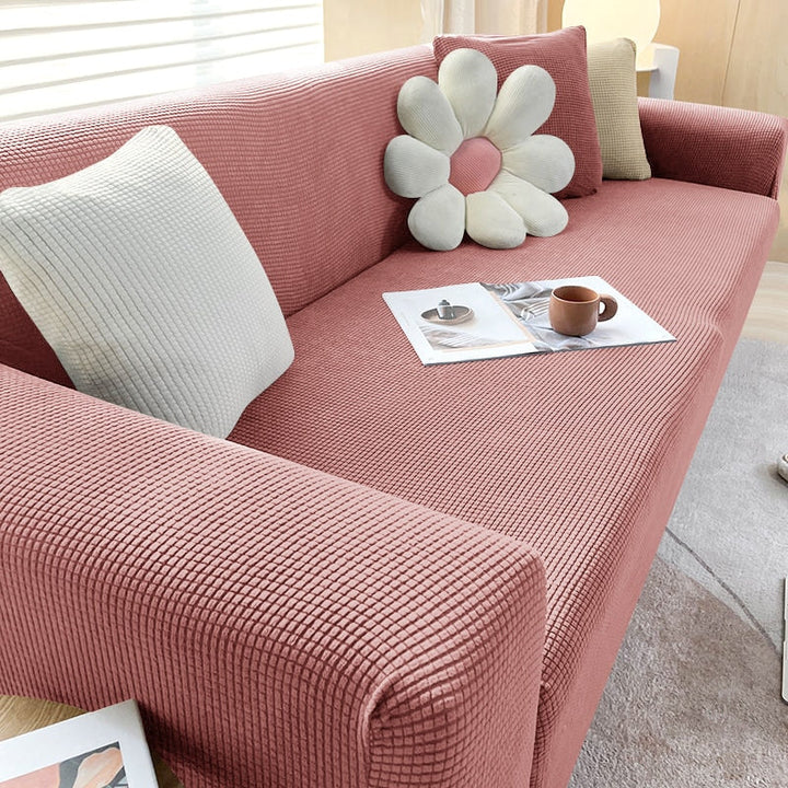 Beige Sofahusse aus elastischem Stretchmaterial, perfekter Sitz, Schutz vor Flecken, Schmutz und Tierhaaren.