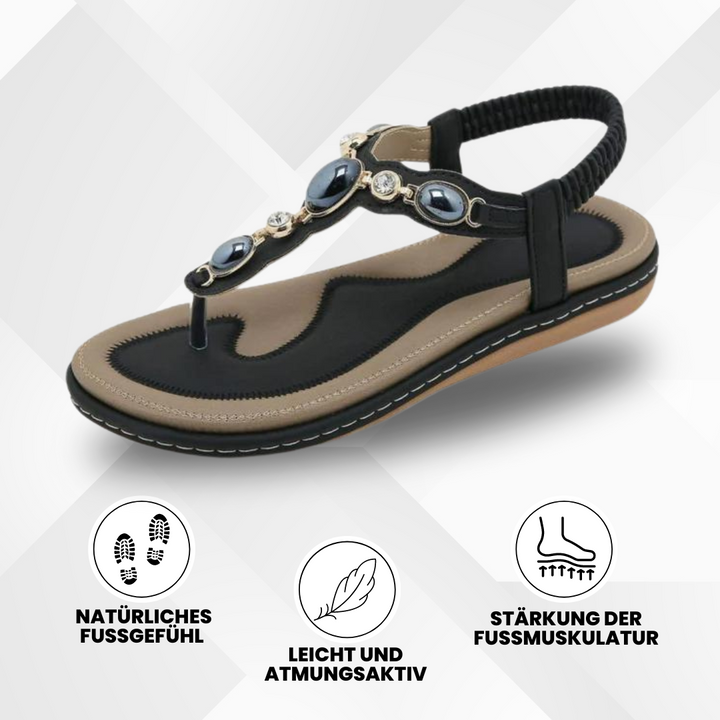 Bequeme, ergonomische Sandalen in Aprikose mit rutschfester Sohle zur Förderung der Fußgesundheit auf hellem Hintergrund.