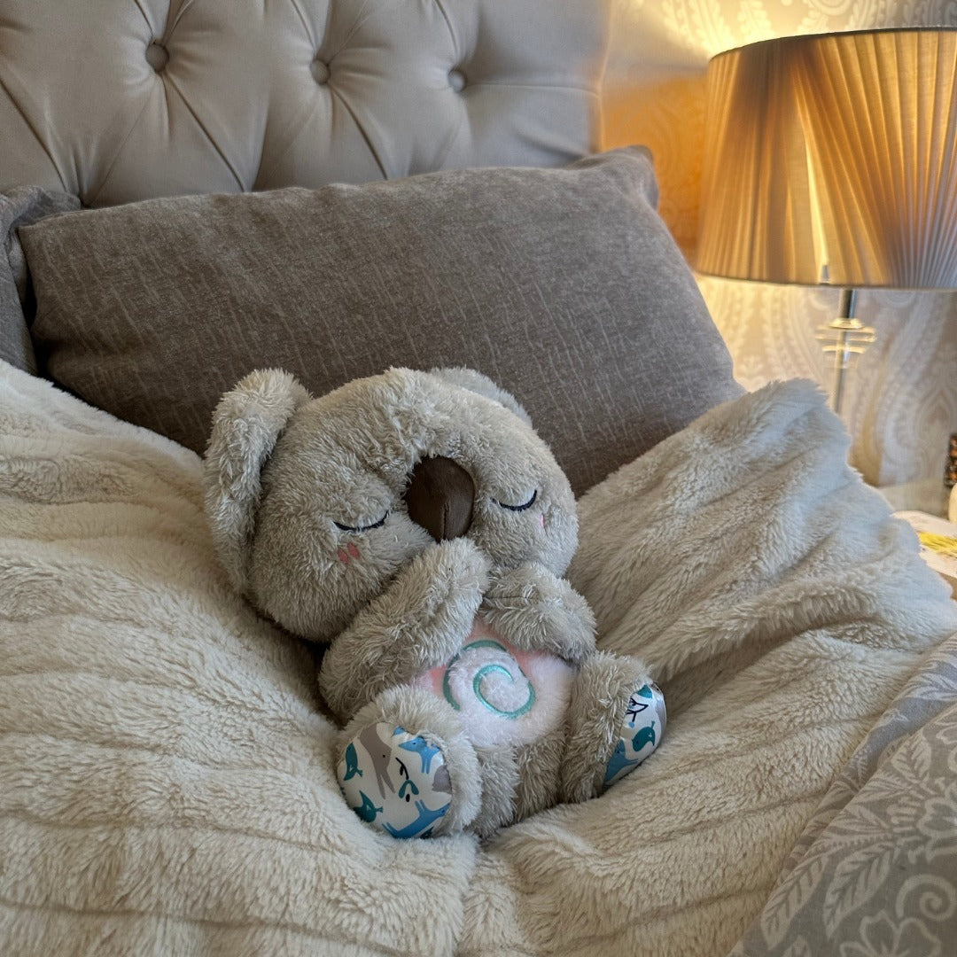 "Beruhigendes Koala-Atemspielzeug für Kinder, simulierende Atembewegung, sanfte Farben und integriertes Nachtlicht."