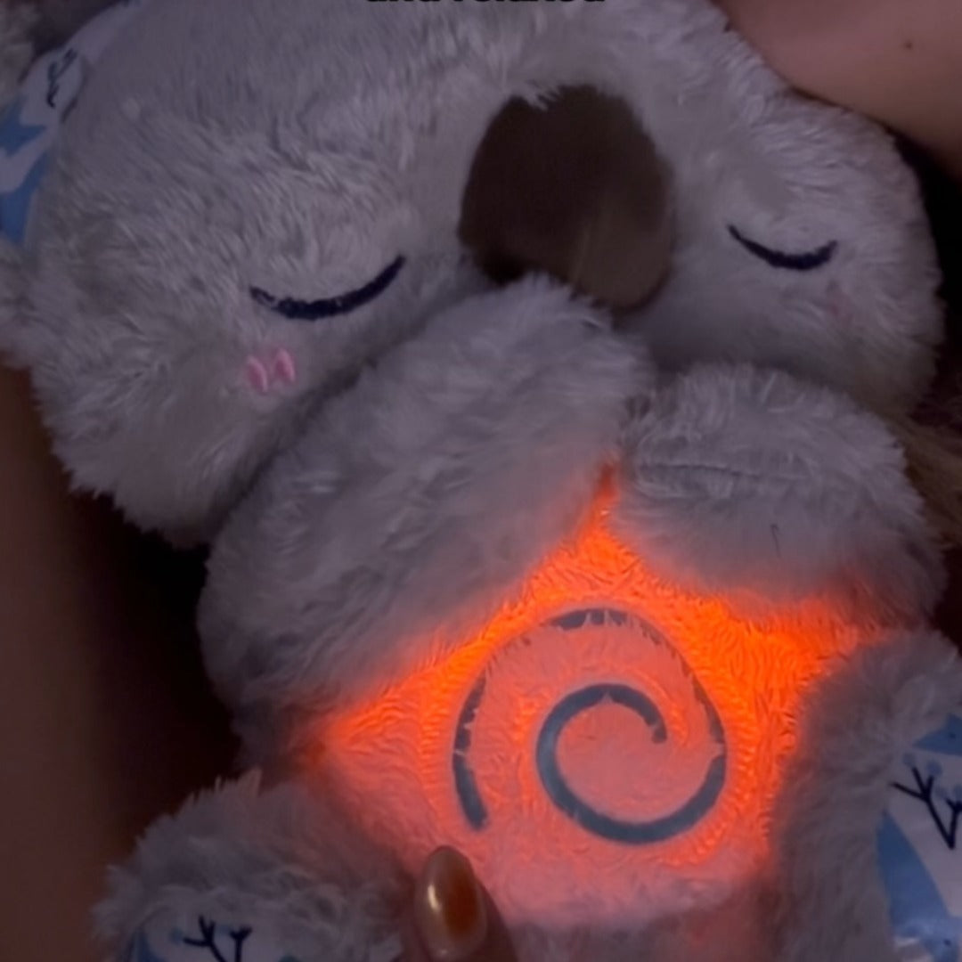 "Beruhigendes Koala-Atemspielzeug für Kinder, simulierende Atembewegung, sanfte Farben und integriertes Nachtlicht."