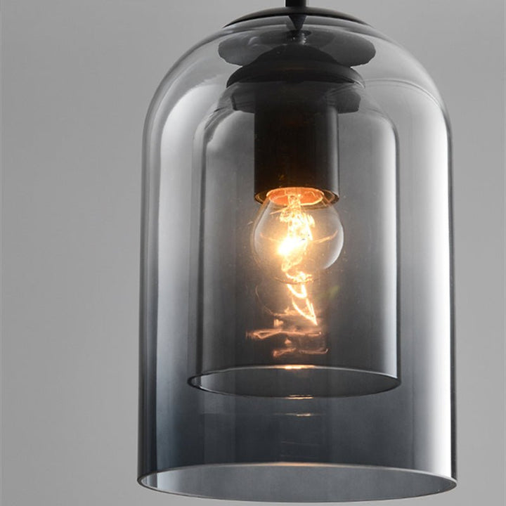 "Doppelglas-Pendelleuchte aus Rauchglas mit rostigem Finish, elegantes Design für moderne Inneneinrichtung."