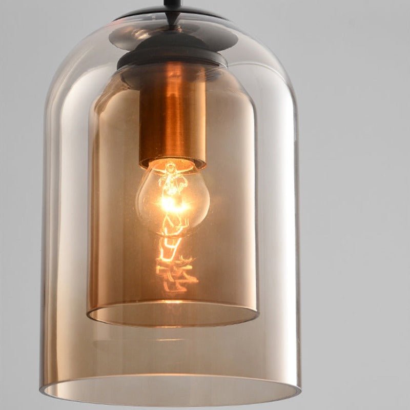 "Doppelglas-Pendelleuchte aus Rauchglas mit rostigem Finish, elegantes Design für moderne Inneneinrichtung."