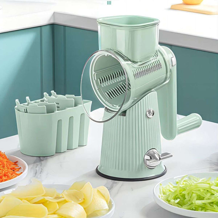 "Effiziente kompakte Küchenreibe in Grün, robustes Design für sicheres Schneiden und Reiben von Gemüse und Obst."