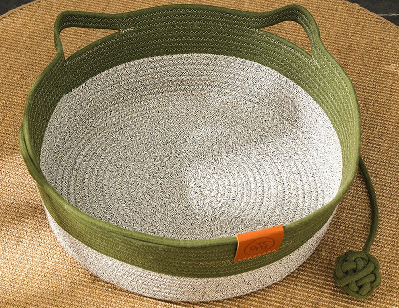 "Handgewebtes ergonomisches Katzenbett aus natürlichem Baumwollseil – stilvoller Schlafplatz, sicher, in Grau gezeigt."
