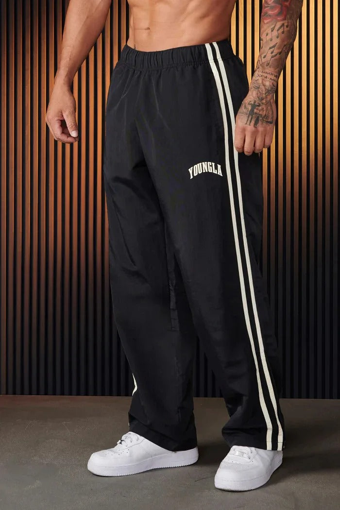 "Herren-Sporthose mit Patchwork-Design, doppelseitigen Streifen in Schwarz-Weiß, flexibel und komfortabel für Sport und Allta