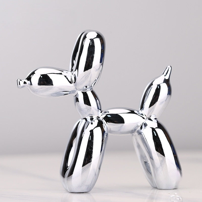 "Kupferfarbene Ballonhund Skulptur, verspieltes Deko-Objekt mit glänzender Metalloberfläche, ideal für Wohnräume."