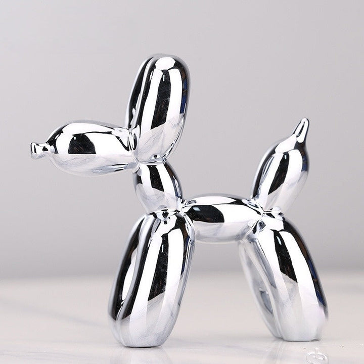 "Kupferfarbene Ballonhund Skulptur, verspieltes Deko-Objekt mit glänzender Metalloberfläche, ideal für Wohnräume."