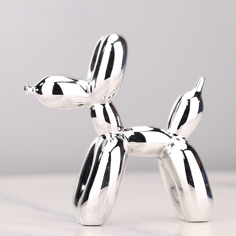 "Kupferfarbene Ballonhund Skulptur, verspieltes Deko-Objekt mit glänzender Metalloberfläche, ideal für Wohnräume."