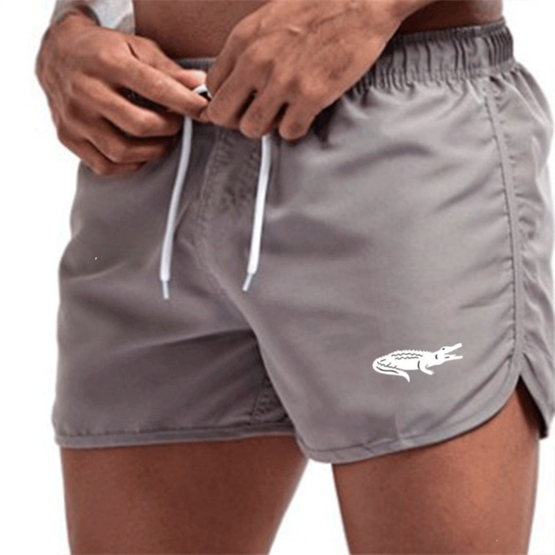 "Mehrfarbige, leichte Strand-Shorts mit elastischem Bund und modernem Druck, perfekt für Sommer und Sport."