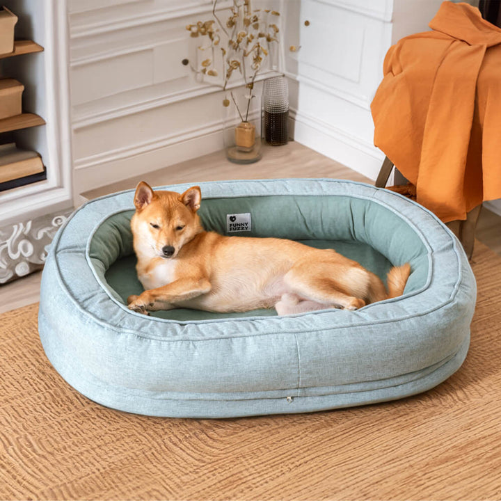 "Orthopädisches flauschiges Haustierbett in Donutform, beige, für Hunde, bietet Komfort und Unterstützung auf glatten Böden."