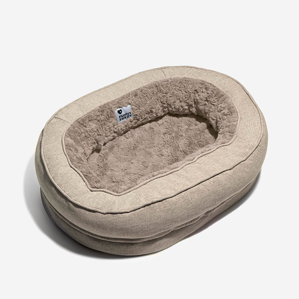 "Orthopädisches flauschiges Haustierbett in Donutform, beige, für Hunde, bietet Komfort und Unterstützung auf glatten Böden."