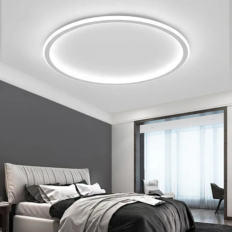 Runde LED-Deckenleuchte in skandinavischem Design, minimalistisch mit warmem Licht, ideal für Wohnraum oder Schlafzimmer.