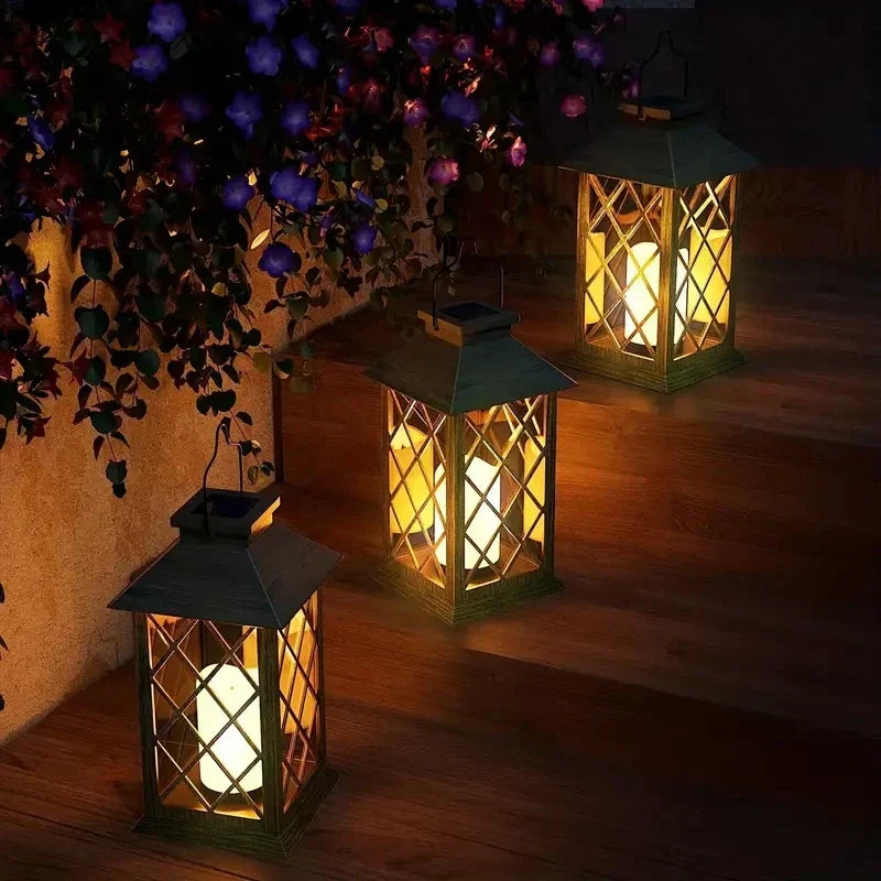 Solarlampe Noctis Gartenlaterne mit flackernder LED-Kerze, warmes Licht, wetterfest, ideal für Gartenbeleuchtung.