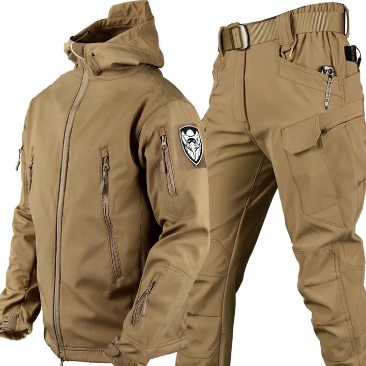 Taktische Outdoor-Jacke und Hose, wind- und wasserdicht, in Grau, ideal für Abenteuer, mit Kapuze und elastischem Bund.