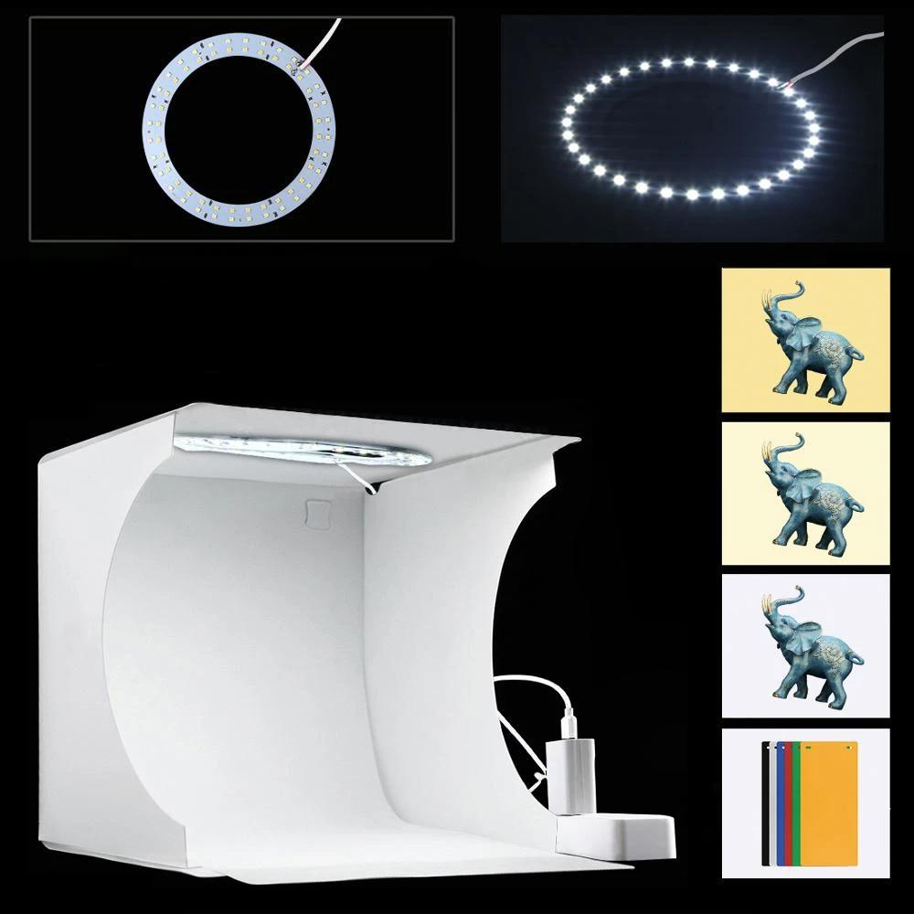 Tragbares LED-Fotostudio mit heller Beleuchtung, ideal für hochwertige Produktfotografie wie Schmuck und Gadgets.