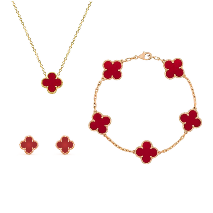 "Zeitloser Aurora Klaverset Schmuck aus vergoldetem Silber in luxuriöser Box, ideal für festliche Anlässe."